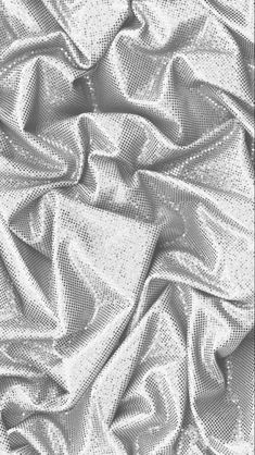 an image of a white cloth textured with metallic threads or mesh fabric background