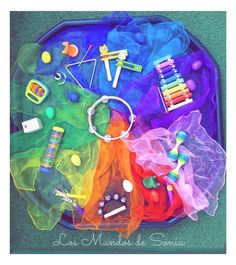 an assortment of colorful items on a blue tray with writing utensils and crayons