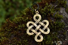 Sterling silver 925 or bronze pendant. Handmade by a jeweler with more than 25 years of experience in jewelry making and designing.   The endless knot, also called eternal knot is a symbolic knot without a beginning and without an end. It is found in Jainism and Buddhism, but also in Celtic and Chinese cultures. The symbol has been known already in Bronze Age, 2500 BC.  In Buddhism it is one of the Eight Auspicious Symbols. Endless Knot symbolizes Buddha's endless wisdom. It also shows that ther Spiritual Bronze Jewelry For Anniversary, Cadmium-free Bronze Jewelry Gift, Symbolic Gold Infinity Jewelry, Symbolic Infinity Gold Jewelry, Symbolic Infinity-shaped Gold Jewelry, Infinity Symbolic Jewelry For Gift, Symbolic Infinity Jewelry For Gifts, Symbolic Infinity Jewelry For Gift, Spiritual Infinity Shaped Jewelry Gift