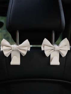 two bows on the back seat of a car