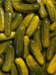 a bunch of pickles on top of each other