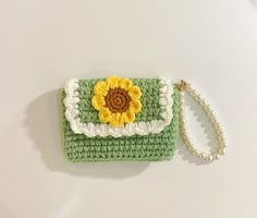 a crocheted purse with a sunflower on it