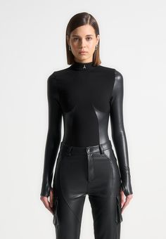 Black High Neck Long Sleeve Bodysuit Perfect for evenings out, this bodysuit sculpts the body perfectly using the vegan leather underbust contour panelling. The vegan leather sleeves mould the arms to create slim, elongated arms. Thong Bodysuit Silhouette Bandage Main Body Vegan Leather Contouring Vegan Leather Sleeves Leather Sleeves, Leg Sleeves, Bodysuit Black, High Neck Long Sleeve, Leather Sleeve, Leather Outfit, Eyeshadow Makeup, Womens Bodysuit, Black Bodysuit