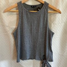 Express Sleeveless Summer Tank. Tie Front Embellishment. Gray. Medium. New With Tags. Lightweight Breathable Design. This Piece Is Formfitting And Very True To Size. It Almost Runs Slightly Small. Modestly Cropped. A Wonderful Casual Piece To Add To Your Summer Collection. Pair With Your Favorite High Waisted Shorts. Light; Breathable; Racerback; Thin; Crop; Tank Top Cell Phone Holster, Phone Holster, Crop Tank Top, Summer Tank, Walker Boots, Fit N Flare Dress, Rain And Snow Boots, Boot Sandals, Crop Tank