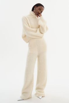 Bring luxury into your everyday wardrobe with the TARAN Wool Pants, crafted from a plush alpaca blend that exudes comfort and sophistication. These pull-on pants feature a semi-fitted cut, slash pockets, and a straight leg with a slight flare at the bottom. Pair them with the GARCELLE Wool Sweater and pointed heels for a trendy, cold-weather statement, or with a silk shirt for a luxe look that's perfect for a night out. Wool Turtleneck Sweater, Alpaca Sweater, Pointed Heels, Wool Turtleneck, Wool Pants, Casual Clothing, Swim Accessories, Pull On Pants, Everyday Wardrobe