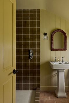 a bathroom with a sink, mirror and bathtub in the corner next to each other