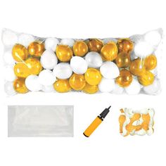 an assortment of gold and white balloons in a bag with marker, markers and plastic bags