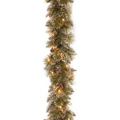 a christmas garland with pine cones and lights on the bottom, hanging from a white wall