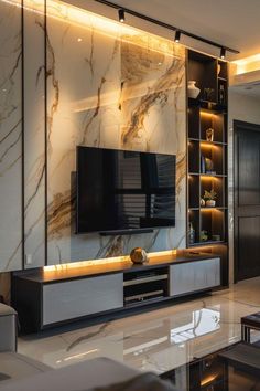 a living room filled with furniture and a flat screen tv on top of a wooden entertainment center