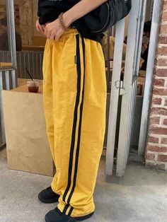 ⚡Buy 2023 Contrast Color Stripe Patchwork Wide Leg Pants Yellow M under $39.00 in Pants at AnotherChill.com Online. Style: Casual/Street/Punk/Vintage/Hip Pop. Fabric Content: Polyester. Fit Type: Loose fit. Eye Catching Color: The vibrant and lively yellow color of these pants is sure to turn heads wherever you go, making them a must have for those who like to stand out from the crowd.. Casual and Sporty: The loose fit design of these pants gives them a casual and sporty feel, making them perfect for everyday wear or for sporting activities.. Versatile Style: With a mix of casual, street, punk, vintage, and hip hop styles, these pants can be paired with a variety of tops and accessories, making them a versatile addition to any wardrobe.. High Quality Fabric: Made from polyester, this pants Streetwear Yellow Pants With Elastic Waistband, Yellow Pants With Elastic Waistband For Streetwear, Baggy Yellow Bottoms For Spring, Yellow Baggy Bottoms For Spring, Yellow Ankle-length Pants With Elastic Waistband, Yellow Straight Leg Bottoms With Elastic Waistband, Yellow Stretch Tapered Leg Bottoms, Casual Full-length Yellow Bottoms, Yellow Trousers With Elastic Waistband