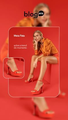 a woman sitting on top of a red box with her legs crossed and wearing high heels