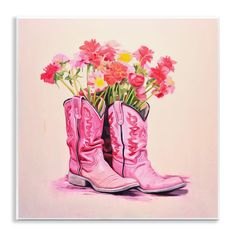 a painting of pink cowboy boots with flowers in them