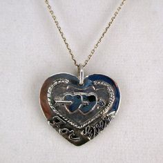 "This antiqued sterling silver, two-sided, solid Forever and Ever Heart pendant features a double-pierced heart design with \"Forever\" inscribed on the front and \"And Ever\" inscribed on the back. Marked, Sterling. Made by Brown County Silver. Vintage and in new, never worn condition. Approximately 30 years old. 1 1/8\" high with jump ring 1 1/8\" wide 6.9 grams See more @ https://www.etsy.com/shop/brocosi" Silver Sterling Heart Necklace For Memorial, Nickel-free Heart Necklace For Anniversary, Nickel Free Double Heart Jewelry For Anniversary, Vintage Nickel-free Heart Necklace For Anniversary, Nickel-free Double Heart Necklace For Anniversary, Personalized Vintage Silver Heart Necklace, Silver Heart Necklace With Hallmark, Nickel Free Jewelry For Anniversary On Valentine's Day, Vintage Sterling Silver Heart Necklace Nickel Free