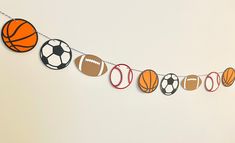 a garland with sports balls and basketballs on it