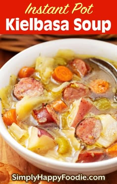 a white bowl filled with kielbasa soup on top of a wooden table