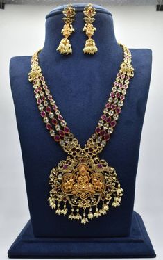 Elegant gold finish Laxmi Haram with earring worked with rice pearl Elegant Gold Pearl Necklace With Latkans, Gold Pearl Necklace With Latkans Temple Style, Heavy Gold Pearl Necklace For Diwali, Heavy Gold Pearl Necklace For Festivals, Maha Lakshmi, Multi Strand Necklace, Strand Necklace, Multi Strand, Indian Jewelry