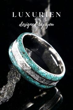 This stunning ring combines the gentle color of turquoise with the rare texture of meteorite to give you a wedding band that is unique and unmatched. Visit our website and find the perfect ring for you! #weddingrings #mensfashion #womensrings Men’s Turquoise Wedding Band, Meteorite Wedding Ring, Meteorite Wedding Rings, Turquoise Wedding Band, Custom Wedding Ring, Cool Rings For Men, Gibeon Meteorite, Damascus Ring, Groom Ring