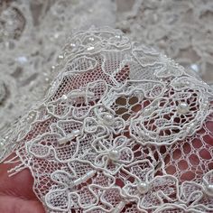 Ivory embroidered lace fabric Ivory Beaded lace fabric Ivory Embroidery sequins and beads fabrics Ivory embroidered lace By the yard fabric  WIDTH: 0.30 m =11.8" COUPON: Two-sided. Price for Length 3.29 yards    Note that each monitor has a different color rendition. The color in reality can be a little different! See lace in other categories: 1) 3d lace  :/www.etsy.com/shop/KingdomLace?ref=seller-platform-mcnav§ion_id=23652665 2) Wedding lace here :    https://etsy.me/2IlffOw 3) Flock tulle  he Elegant White Lace With Intricate Embroidery, Elegant Wedding Embroidered Fabric With Lace Trim, Elegant Lace Embroidered Fabric For Wedding, Elegant Lace Embroidered Fabric For Ceremony, Elegant Lace Fabric With Pearl Embroidery, Ecru Lace With Lace Trim For Wedding, Elegant White Embroidered Fabric With Scalloped Lace, Elegant Cream Lace With Intricate Embroidery, Elegant Wedding Lace Fabric And Notions