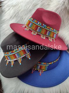 You want to feel the beauty, you want to run that city, you want to be the best then to finalize the masterpiece you need fedora hat. This a combination of African hat of diffrent colours. The colours are well selected to match and alway fit any of your outfit. The upper part has a perfect beaded pattern which always shine and stand on it's own The pattern are multicolored with all beads put in consideration Beads can be made based on your colours prefence.it can be worn during party, beach part Cowboy Hat Beach, African Hat, Hats Fedora, Hats Cowboy, Women Fedora, Beaded Hat Bands, African Hats, Bohemian Sandals, Rainbow Sandals