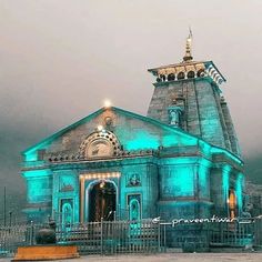 an old church lit up with blue lights