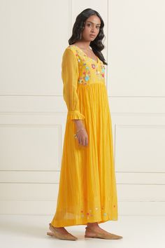 Yellow chaderi fit and flare dress with sequin floral embroidered motifs.
Component: 1
Pattern: Embroidered
Type Of Work: Floral
Neckline: V-Neck
Sleeve Type: Puff
Fabric: Chanderi
Color: Yellow
Other Details: 
Hand embroidered front and back yoke
Pleated sleeve detail
Occasion: Resort,Party - Aza Fashions Resort Party, Embroidered Motifs, Gathered Dress, Pleated Sleeves, Fashion App, Indian Ethnic Wear, Sleeve Detail, Dress For Women, Yellow Floral