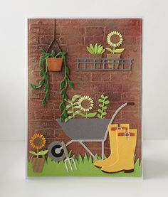 a card with flowers and gardening items on it