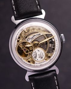 Experience the mesmerizing allure of the vintage Sputnik Skeleton watch - a captivating timepiece that unveils the intricate dance of mechanics and artistry. Unlike any other, this watch features a partial dial and exposed movement, allowing you to witness the inner workings with every glance. The delicate balance of the watch's mechanism mirrors the rhythmic beating of a heart, evoking a profound sense of connection and wonder. With each tick and tock, this timepiece creates a symphony of motion that resonates deep within. Encased in a versatile 35mm diameter, this watch effortlessly adorns any wrist, embodying timeless style and sophistication. At 6 o'clock, a unique circular second hand gracefully rotates, offering a mesmerizing display of time's passage. Elevate your wristwear collecti Steampunk Automatic Watch For Formal Occasions, Steampunk Watch With Skeleton Dial, Steampunk Style Watch With Subdials As Gift, Steampunk Silver Watch With Skeleton Dial, Timeless Skeleton Dial Watch For Anniversary, Timeless Anniversary Watch With Skeleton Dial, Gold Steampunk Watch With Skeleton Dial, Evening Chronometer Round Watch, Round Chronometer Watch For Evening