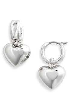 High-polished drop earrings have an innovative suspension design allowing the luminous heart to glide back and forth between the rails for subtle movement. 1/2" hoop diameter; 1" drop Snap-post closure 14k-gold plate Imported Valentine's Day Polished Finish Earrings, Elegant Sterling Silver Huggie Earrings With Heart Charm, Elegant Silver Huggie Heart Earrings, Elegant Sterling Silver Heart Huggie Earrings, Elegant Heart-shaped Sterling Silver Huggie Earrings, Elegant Dangle Huggie Earrings With Heart Charm, Silver Elegant Huggie Earrings With Heart Charm, Silver Huggie Earrings For Valentine's Day Elegant Style, Elegant Double Heart Huggie Earrings With Heart Charm