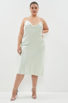 Live out your Nineties style dream in this silky satin slip dress. Detailed with a draped cowl neckline and slender spaghetti straps, this slinky, curve-skimming design is sure to turn heads at every summer soiree.Expertly designed for those size 18 and above, our plus size collection is perfectly proportioned to ensure you look stylish at every shape.Style: Slip DressDesign: PlainFabric: SatinLength: MidiNeckline: CowlSleeve Length: Sleeveless Cowl Neck Midi Dress, Plus Size Satin, Summer Soiree, Cowl Neckline, Satin Slip Dress, Satin Slip, Look Stylish, Cowl Neck, Plus Size Dresses