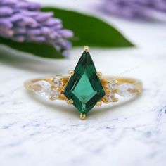 Kite Cut Emerald Ring, Diamond Cluster Promise Ring, Green Gemstone Engagement Ring, 14k Yellow Gold Bridal Jewelry, May Birthstone Gifts Main Stone- Emerald Cut of Stones - Faceted  Stone size - 9x5 mm Stone Color-Green Stone Shape - Kite Creation-Lab Created Secondary Stone - CZ Diamond Stone Shape Marquise / Round Stone Color - Colorless Stone Grade - AAA+ Check out my other items!   PAYMENTS   We accept PayPal, If we do not receive payments immediately we will hold the item only for one work Green Gemstone Engagement Rings, Smaragd Ring, Gemstone Engagement, Birthstone Gifts, Bridal Gold Jewellery, Cz Diamond, Green Gemstones, Diamond Cluster, Emerald Ring