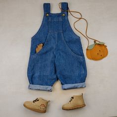 Link to youtube sew along: https://youtu.be/3LuTBEfIaxY Sizes: 12 MONTHS TO 14 YEARS Formats: A4/Letter, A0 and Projector Fabric: Medium weight woven Skill level: Intermediate Classic dungarees (or pinafore) features adjustable straps, an oversized fit, and convenient side and top pockets. All openings are finished with a single folded hem. Diy Dungarees, Dungaree Pattern, Kids Dungarees, Bib Dress, Jumper Patterns, Kids Sewing, Handmade Wardrobe, Sewing Patterns For Kids, Photo Tutorial