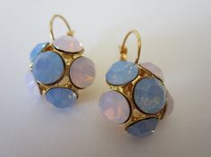 Amazing gold plated earrings placed with Swarovski Rose Water Opal and Air Blue Opal Chaton rhinestone.  These stunning earrings will be the perfect completion for a glow and unforgettable look!