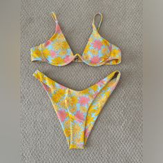 Shein Flower Power Bikini And Wrap. Never Worn, Like New Condition. Top Is Underwire With Clasp In Back. Bottoms Are Cheeky With High Led Cuts. Large Top And Bottom. Selling As A Set. Yellow Floral Print Swimwear For Poolside, Yellow Floral Print Swimwear For Beach Party, Yellow Floral Print Beachwear Swimwear, Yellow Fitted Swimwear With Tropical Print, Yellow Floral Print Swimwear For Beach, Fitted Yellow Tropical Print Swimwear, Yellow Tropical Swimwear With Floral Print, Tropical Yellow Swimwear With Floral Print, Tropical Yellow Floral Print Swimwear