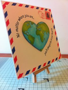 a card with a heart shaped earth on it and the words whatever where you are