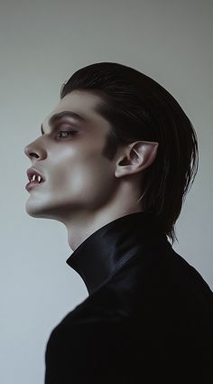 a man with dark hair wearing a black shirt and tie looking off into the distance