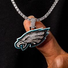 Nothing accentuates your fit like the perfect drip! GLD has teamed up with the National Football League to introduce the official NFL Team Pendants. This piece was meticulously crafted with a mixture of clear and black hand-set stones to accurately depict the logo of the Philadelphia Eagles. Boss up and rep your squad with the official pendant of the Philadelphia! This product is guaranteed for life - GLD will repair the item should you experience any defects in craftsmanship or breakage. Pendan The Eagles, Gold Piece, Vermeil Jewelry, Custom Earrings, Gold Hands, Black Hand, National Football League, Philadelphia Eagles, Football League