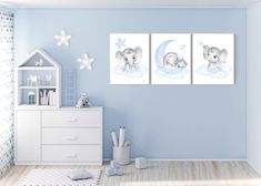 three pictures of animals on the wall in a child's room with blue walls