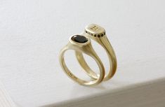 "Queen Crown ring - A minimalist flat top oval signet ring made of 14K yellow gold with  black round cut onyx / spinel set in a delicate frame - a new interpretation for a woman signet modern ring. This timeless piece is designed to create a delicate statement ring that could be the perfect ring for any special event such as graduation / retirement / birthday gift. This ring is made of solid yellow gold but could be ordered in 14K white or rose gold  Specifications: Top oval size: 6.5X9 mm / 0.26\" X 0.35\" Inch Stone Size: 5X7 mm / 0.2\" X 0.28\" Inch Bottom ring thickness: 2 mm / 0.08\" Inch Top height: 5 mm / 0.31\" Inch * You wish to have engraving on this ring?  please enter:     https://etsy.me/2Hl40bo * Feel free to contact me with any questions or requests. FOR MATCHING ITEMS http: Minimalist Oval Gemstone Signet Ring, Minimalist Gemstone Signet Ring For Formal Occasions, Minimalist Oval Sapphire Ring With Polished Finish, Classic Everyday Signet Ring With Gemstone, Elegant Oval Signet Ring With Smooth Bezel, Classic Gemstone Signet Ring For Everyday, Oval Signet Ring With Bezel Setting For Everyday, Modern Oval Initial Ring For Wedding, Classic Signet Ring With Bezel Setting For Everyday