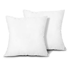 two white pillows sitting next to each other