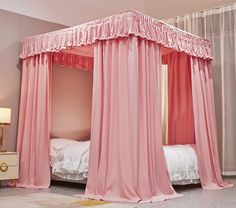 a canopy bed with pink drapes and curtains