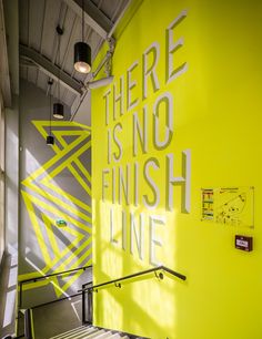 there is no finish line on the wall in this office building with bright yellow paint