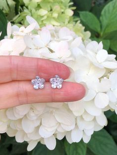 925 Sterling Silver Cz Flower Stud Earrings - Metal: 925 Sterling Silver (Finish: Rhodium Plated) - Stone: Clear Cubic Zirconia, Pear Cut, Prong - Shape: Flower - Dimension: 9mm(0.35 in), Thickness 1.5mm (Please note that the flower is SMALL.) - Closure: Post at Center, Push Back - Color: Silver Diamond Flower Earrings For Anniversary, Sterling Silver Flower Earrings For Anniversary And Mother's Day, Diamond White Flower Earrings For Anniversary, Sterling Silver Flower Charm Earrings For Anniversary, Mother's Day Sterling Silver Flower Earrings, Sparkling Flower Earrings For Anniversary, Sparkling Flower Jewelry For Anniversary, Sparkling Flower-shaped Jewelry For Anniversary, Hypoallergenic Flower-shaped Earrings For Anniversary