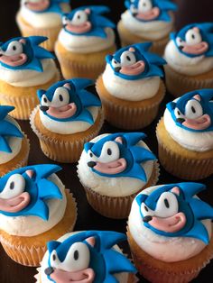 cupcakes with blue and white frosting decorated like sonic the hedgehog characters