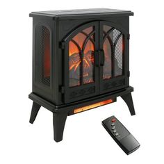 an electric fireplace with a remote control on the side and a black stand next to it