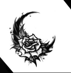 a black and white drawing of a crescent with a rose on it