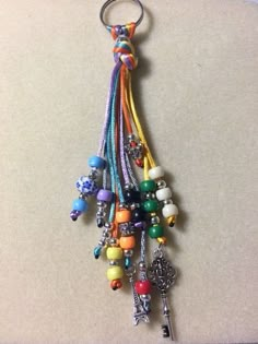 a bunch of beads hanging from a key chain