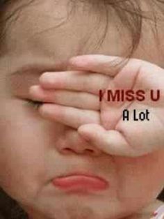 a young child covering his eyes with the words miss u