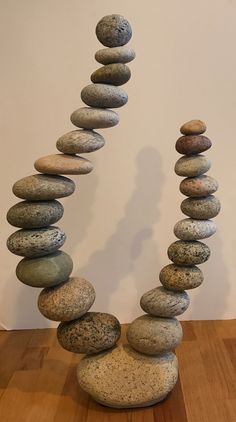 a stack of rocks sitting on top of a wooden table