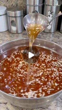 the sauce is being poured into the pan