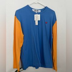 Comme Des Garons Long Sleeve Tshirt. New With Tag Blue Long Sleeve Color Block T-shirt, Blue T-shirt For Fall Streetwear, Orange Long Sleeve Top For Streetwear, Casual Blue Color Block T-shirt, Blue Color Block Tops For Streetwear, Orange Color Block Tops For Fall, Fall Orange Color Block Tops, Casual Blue Color Block Shirt, Spring Blue Color Block T-shirt